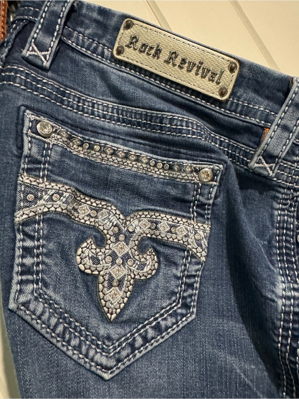 Rock Revival Women's Blue Boot Cut Jeans with Silver Embellished Pocket